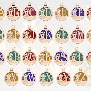 May include: Wooden Christmas ornaments, each featuring a letter of the alphabet and a reindeer design. The ornaments are round with a small loop for hanging. Each letter is a different color, including red, blue, and green.