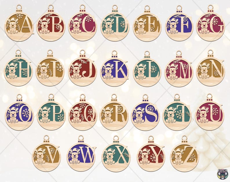 May include: Wooden Christmas ornaments, each featuring a letter of the alphabet and a reindeer design. The ornaments are round with a small loop for hanging. Each letter is a different color, including red, blue, and green.