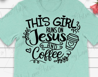 May include: A light blue t-shirt with black text that reads "This girl runs on Jesus and coffee". The text is stylized with a coffee cup graphic and floral accents.