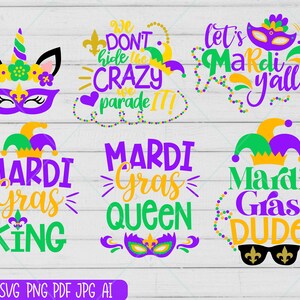 May include: A set of six Mardi Gras themed SVG cut files. The designs include a unicorn with a Mardi Gras mask, a jester hat with the text "Mardi Gras King", a jester hat with the text "Mardi Gras Dude", a jester hat with the text "Mardi Gras Queen", a jester hat with the text "Let's Mardi Y'all", and a jester hat with the text "We Don't Hide the Crazy Parade".