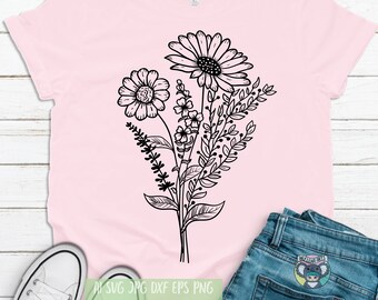 May include: A pink t-shirt with a black line drawing of a bouquet of flowers. The flowers include daisies and smaller flowers with leaves.