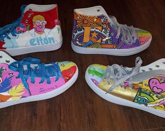 2 pairs of Elton John inspired high top sneakers.