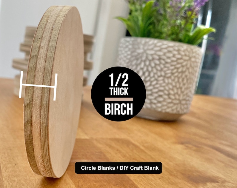 May include: A close-up of a 1/2 inch thick birch wood circle blank. The blank is light brown and has a smooth surface. The text "1/2 THICK BIRCH" is printed on a black circle in the center of the image. The text "Circle Blanks / DIY Craft Blank" is printed below the circle.