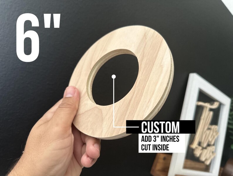 May include: A 6-inch round wooden disc with a 3-inch hole cut out in the center. The disc is light brown in color and has a smooth surface. The text "CUSTOM ADD 3" INCHES CUT INSIDE" is printed on a white label below the disc.