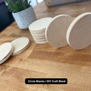 May include: A set of five unfinished wooden circle blanks, perfect for DIY crafts. The blanks are arranged on a wooden surface.