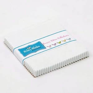 May include: A stack of white fabric squares from Riley Blake Designs, wrapped with a teal and white band. The band features the text "Basics Fabric Collections" and small bird illustrations. The edges of the fabric are scalloped.