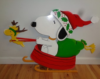 Snoopy and bird as reindeer lawn yard art Christmas decoration.