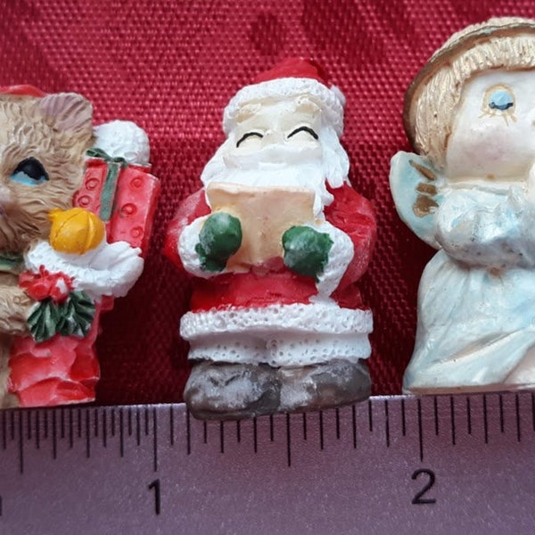 Lot of Three Sculpted Polyresin Christmas Figurines, Angel, Santa Claus and Cat with Stocking