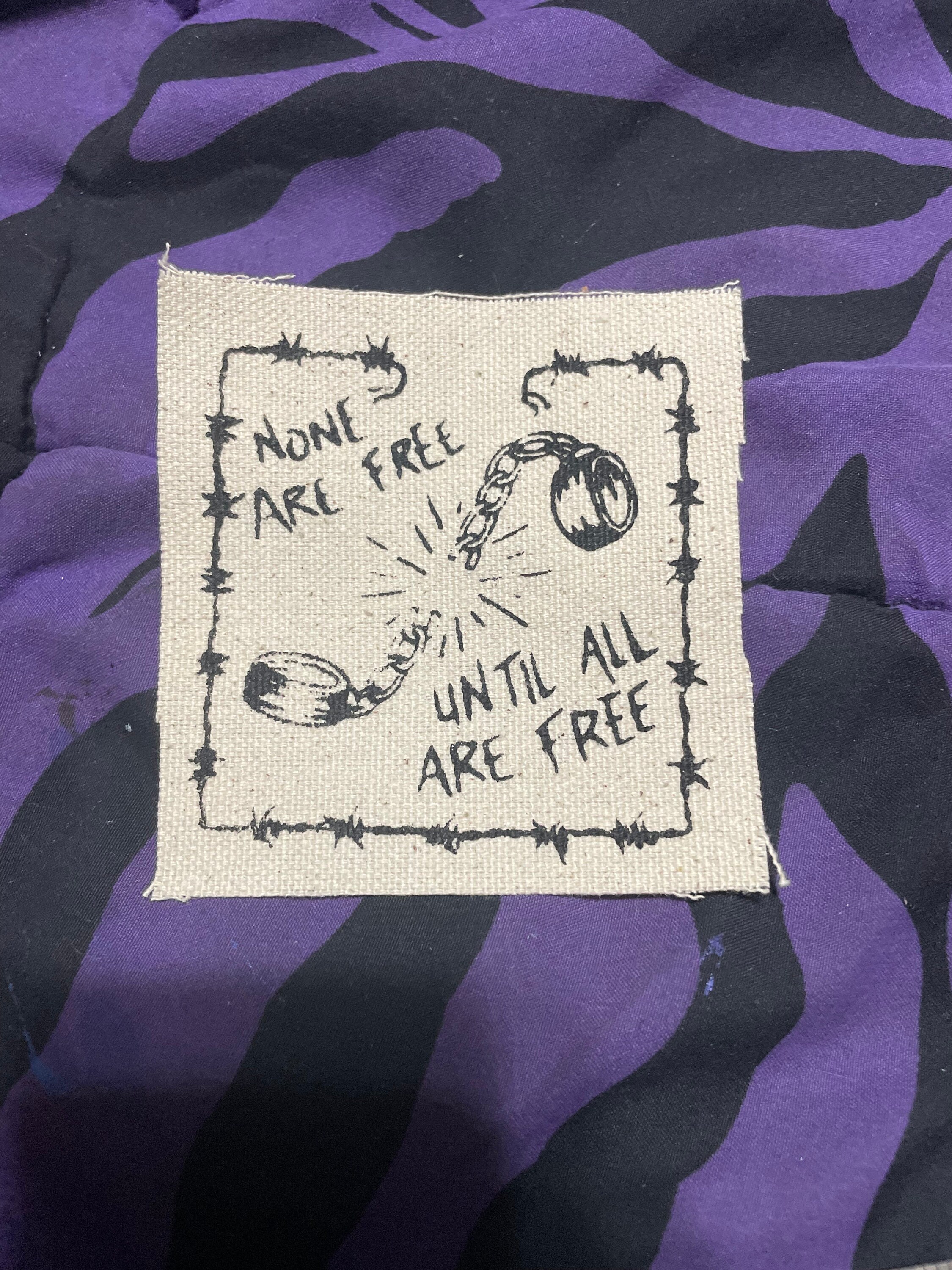 None Are Free Until All Are Free Patch!