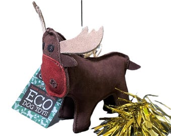 May include: A brown plush moose dog toy with a red nose and gold tinsel tail. The toy is labeled "Darn Good Natural Eco Dog Toys".