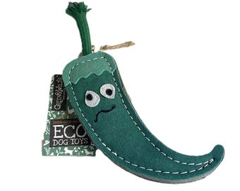 May include: A green plush dog toy shaped like a chili pepper with embroidered eyes and a sad mouth. The toy has a green stem and a tag that reads "Eco Dog Toys".
