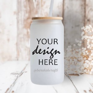 May include: White frosted tumbler with a bamboo lid and a straw. The tumbler has the text "YOUR design HERE" and the social media handle "@barakahcrafts" printed on it.