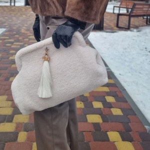 Warm beige clutch bag hotsell