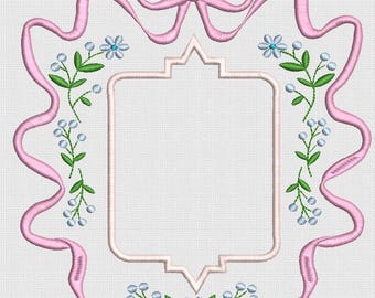 May include: A pink ribbon frame with a bow at the top, adorned with green floral accents and light blue flowers. The frame has a light pink border and a white background, creating a delicate and elegant design.