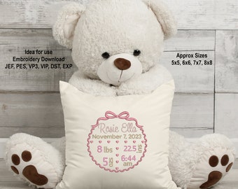 May include: A white plush teddy bear holding a white pillow with pink embroidery. The embroidery includes the name "Rosie Ella", the date "November 7, 2023", and the baby's birth stats: 8 lbs, 22.5 inches, 58, 6:44 am. The pillow also has the text "Embroider Times" at the bottom.