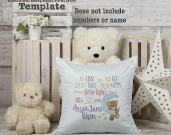 May include: A white pillow with blue embroidery featuring a baby's birth details, including weight, length, and time of birth. The embroidery also includes the text "sleep light little one" and a cute teddy bear design. The pillow is decorated with stars and a crescent moon.