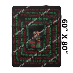 May include: A black and red throw blanket with a graphic of Freddy Krueger from the movie "A Nightmare on Elm Street". The blanket features a repeating pattern of text from the movie, including the famous line "One, two, Freddy's coming for you".