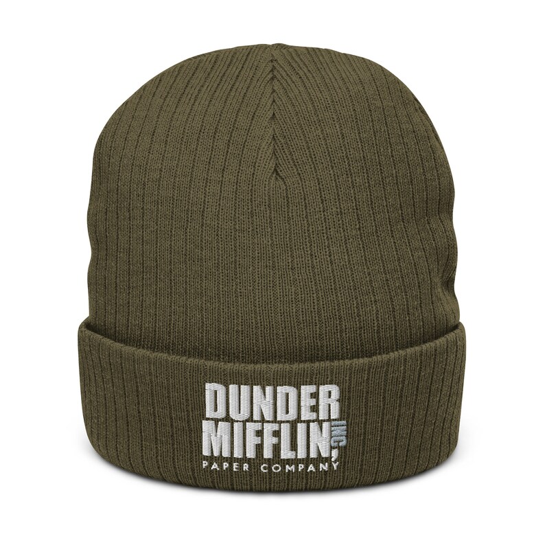 May include: A green knitted beanie with the embroidered text "Dunder Mifflin Inc. Paper Company" in white.