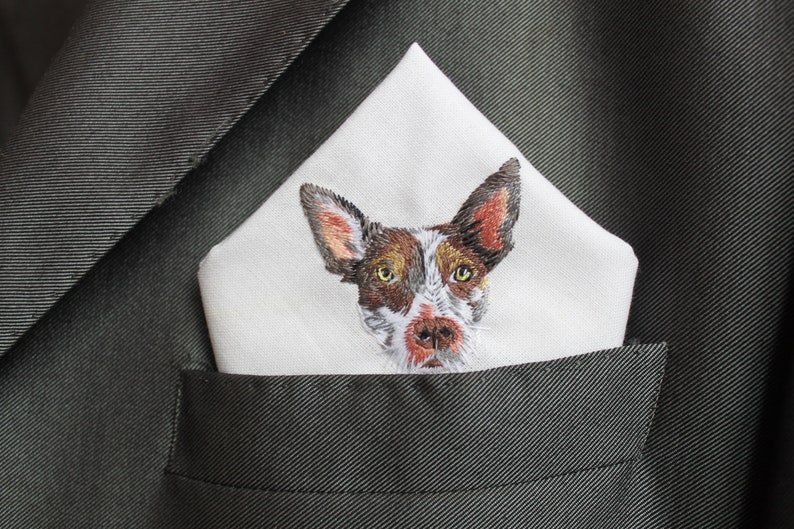 Embroidered dog portrait pocket square worn in a charcoal suit, a keepsake wedding accessory for a dog dad.