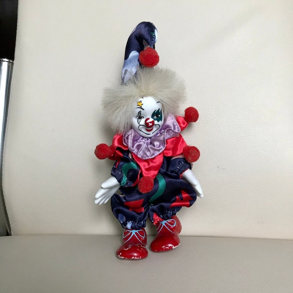 small porcelain clown dolls