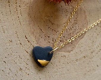 Necklace chain with a small heart pendant in black and gold porcelain