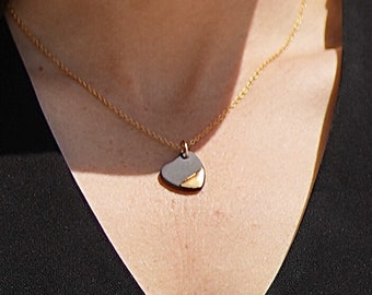 Necklace chain with a large heart pendant in black and gold porcelain