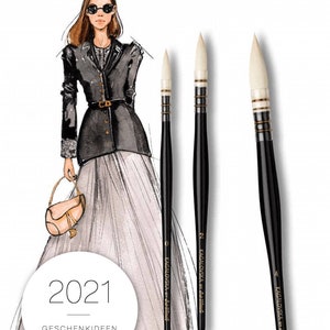May include: da Vinci paintbrushes with black handles and white bristles. The image includes a fashion illustration of a woman in a black jacket and a long skirt. The text "2021 GESCHENKIDEEN GIFT IDEAS" is also visible.