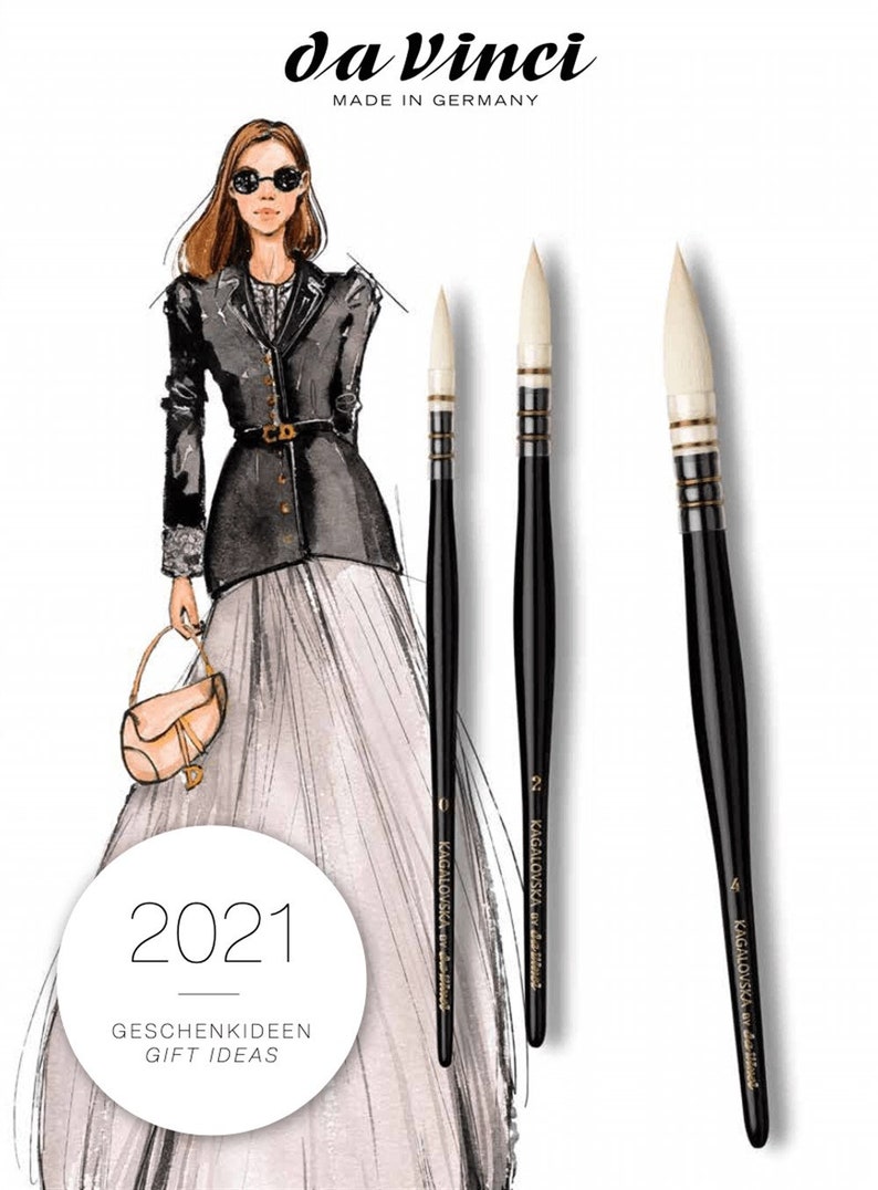 May include: da Vinci paintbrushes with black handles and white bristles. The image includes a fashion illustration of a woman in a black jacket and a long skirt. The text "2021 GESCHENKIDEEN GIFT IDEAS" is also visible.
