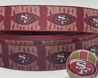May include: Red and gold ribbon with the words "Forever Faithful" and the San Francisco 49ers logo repeated. A small button with the same logo is also included.