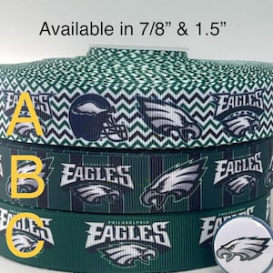 May include: Ribbon spools with Philadelphia Eagles team logos and text. The ribbon is available in 7/8" and 1.5" widths. The ribbon designs include a green and white chevron pattern, the team logo, and the word "Eagles". A button with the team logo is also shown.