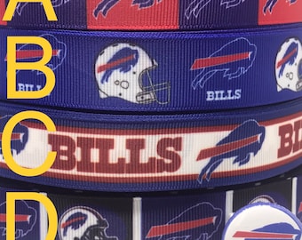 May include: Four rolls of blue and red ribbon featuring the Buffalo Bills logo. The ribbon is available in 7/8 inch or 1.5 inch widths. A small button with the Buffalo Bills logo is also shown.