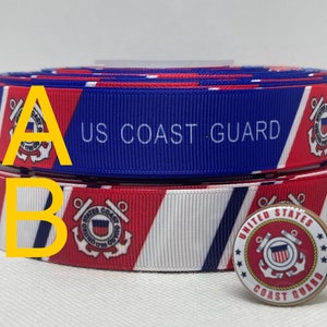 May include: Red, white and blue ribbon with the words "US Coast Guard" printed on it. A small pin with the US Coast Guard emblem is also shown.