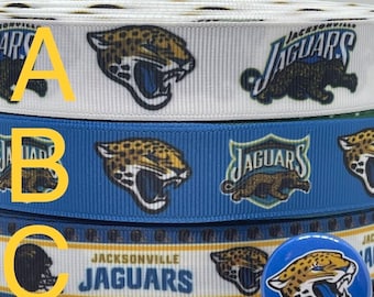May include: Three rolls of white, blue, and white and blue ribbon with a Jacksonville Jaguars logo and the words "Jacksonville Jaguars". A blue button with a Jacksonville Jaguars logo is also shown.