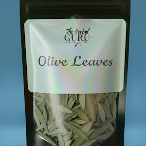 May include: A black stand-up pouch with a clear window containing dried olive leaves. The label features a holographic finish and displays the text The Herbal GURU and Olive Leaves in a dark font. The pouch is sealed at the top with a zip closure.