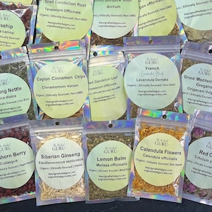 May include: Assortment of small, clear plastic bags filled with dried herbs and flowers. Each bag has a circular label with the text "The Herbal Guru" and the name of the herb, such as "Rosehip" or "Calendula Flowers".
