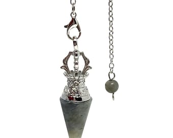 May include: A silver-colored pendulum with a gray, cone-shaped crystal. The pendulum has a decorative top and is suspended by a chain. A separate chain with a small gray bead hangs nearby.