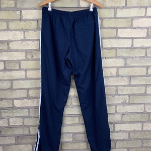 blue and white nike pants
