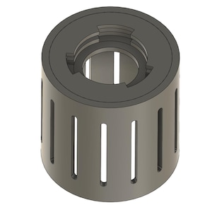 May include: A cylindrical, grey object with a dark grey top and a central opening. The sides feature vertical slots, and the top has a stepped design. The object appears to be a component or part of a larger mechanism.