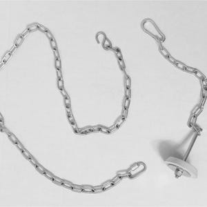May include: A set of three silver-colored chains with various end attachments. One chain has a hook, another has a spring clip, and the third is connected to a white and silver stopper. The chains are arranged on a white background.