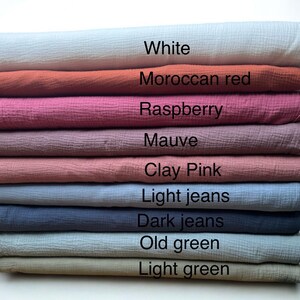 May include: A stack of fabric samples in various colors, including white, Moroccan red, raspberry, mauve, clay pink, light jeans, dark jeans, old green, and light green. Each fabric is labeled with its color name.