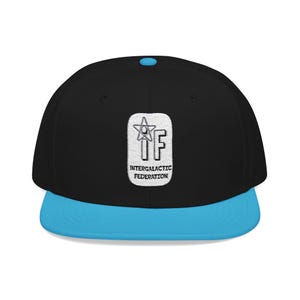 May include: Black and blue Intergalactic Federation baseball cap. The cap features a flat brim and a structured fit. The front displays a white patch with a star and the letters "IF" above the words "Intergalactic Federation".