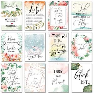May include: Twelve watercolor printable cards with various love-themed quotes and illustrations. The cards feature floral designs, polar bears, hearts, and butterflies. The quotes include "Love is the reason for magic", "Enjoy the time", "Let love bloom", and "Gl&uuml;ck ist..."