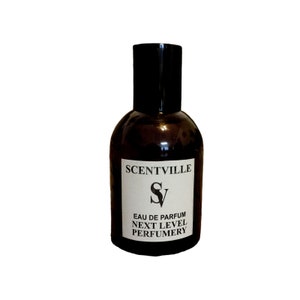 May include: A brown glass bottle of perfume with a black cap. The label reads "Scentville" and "Next Level Perfumery".