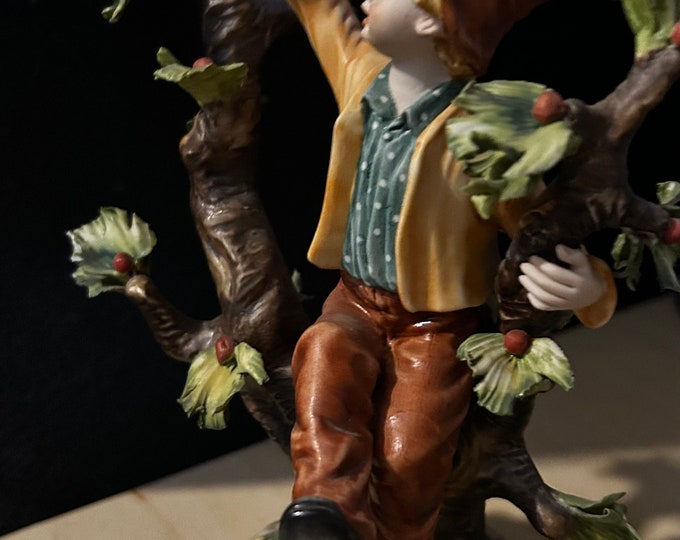 Art collectable, vintage large Italian porcelain figurine of Young Man sitting on apple tree branch.