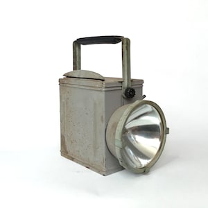 Very old railway lantern. Vintage Ferretti industrial lamp. Rustic outdoor lantern