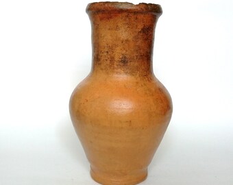 Old beige rustic ceramic pot. Wabi sabi pottery primitive vessel. Terracotta vintage clay vase.