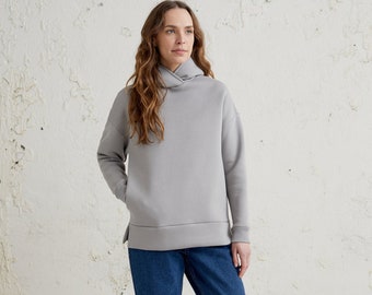 Womens hooded sweatshirt perfect for winter, warm cotton clothing in minimalist style