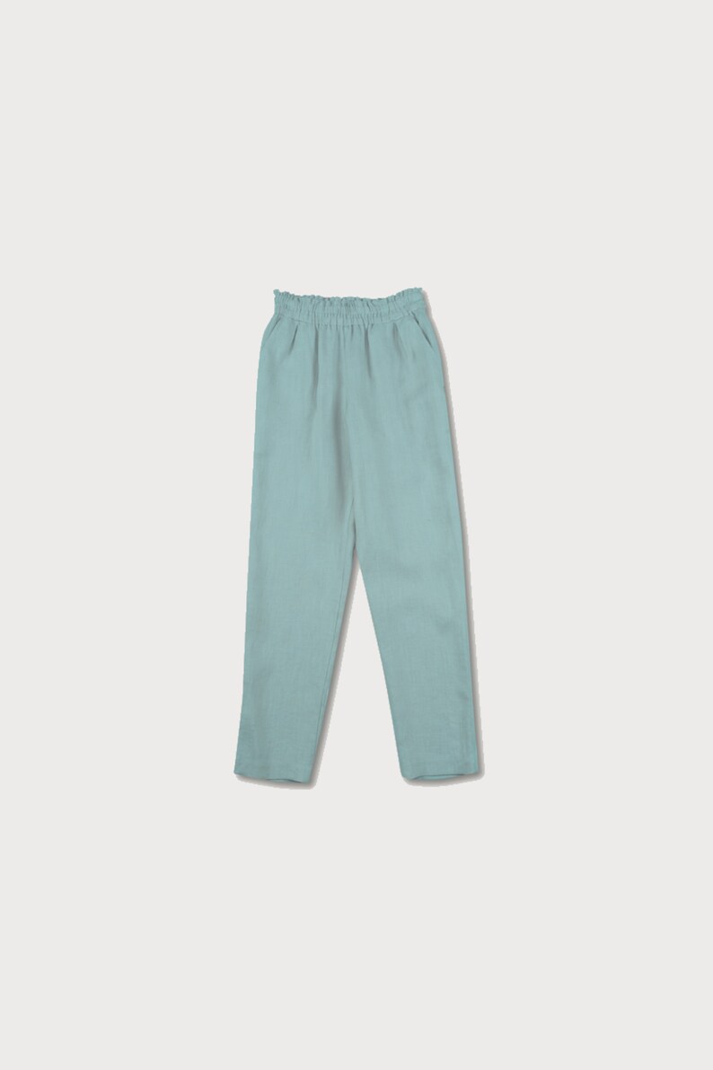 May include: Light blue linen pants with an elastic waistband.
