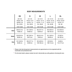 May include: A size chart for clothing with measurements in inches and centimeters. The chart shows the size ranges for XS, S, M, L, and XL. The measurements include bust, waist, and hips.