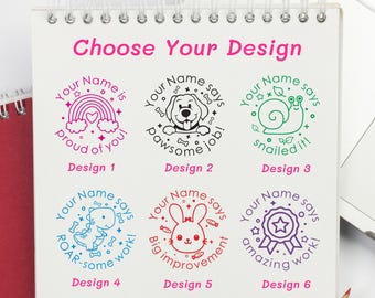 May include: A spiral-bound notepad displays six colorful stamp designs. Each stamp features a circular design with a cute illustration and the phrase "Your Name says" followed by a positive message. The text "Choose Your Design" is at the top.